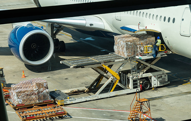 Cargo loading onto plane: Aviation Material Handling Solutions